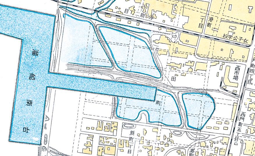 完工後的運河與碼頭，以及未來即將實施的田町市街輪廓。 